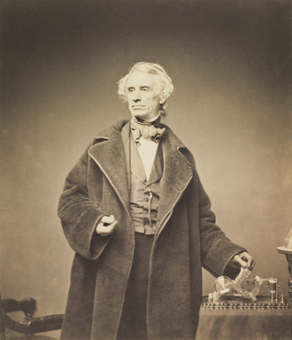 Samuel_Morse_with_his_Recorder_by_Brady_1857.png